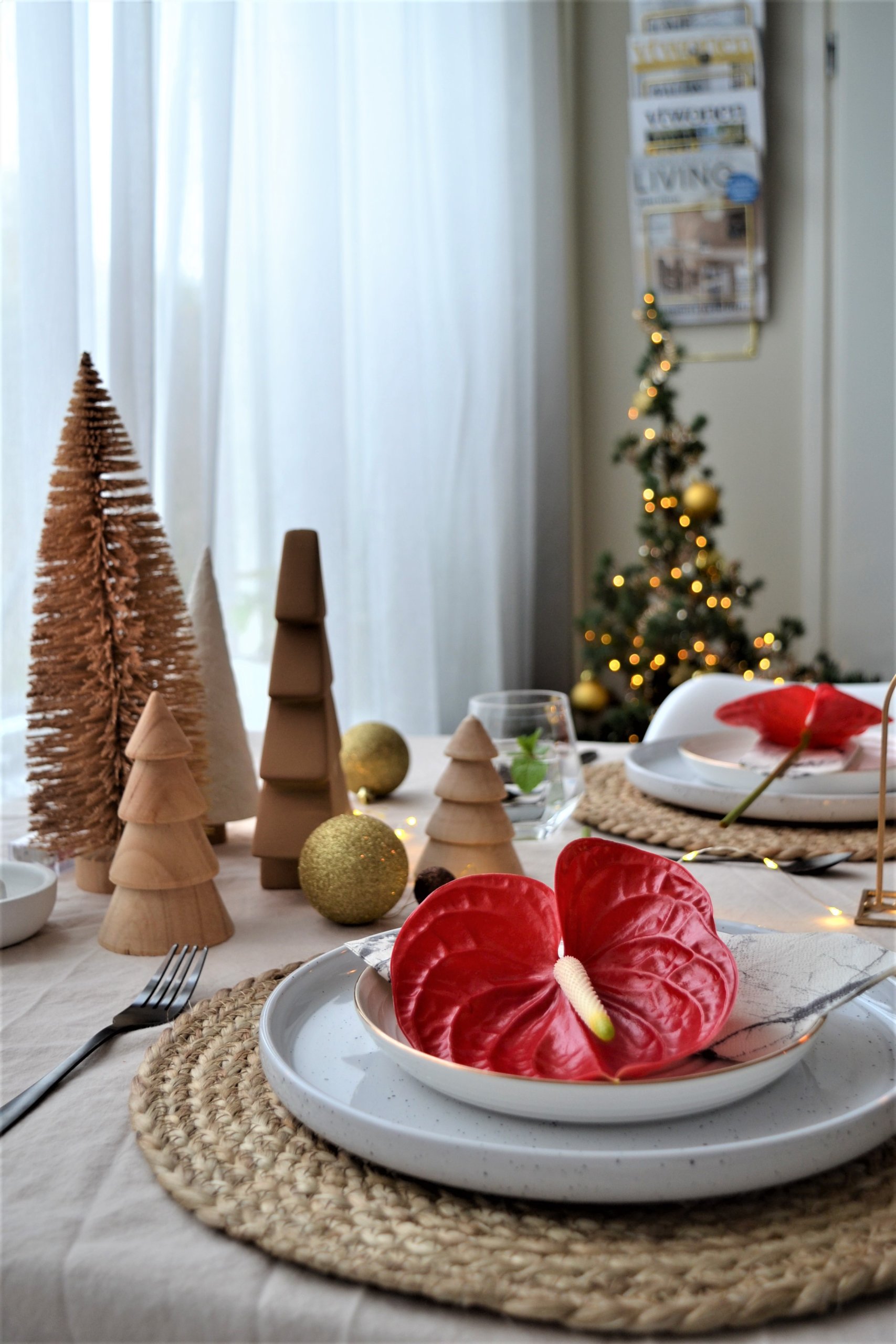 Christmas table setting with red Anthurium flowers