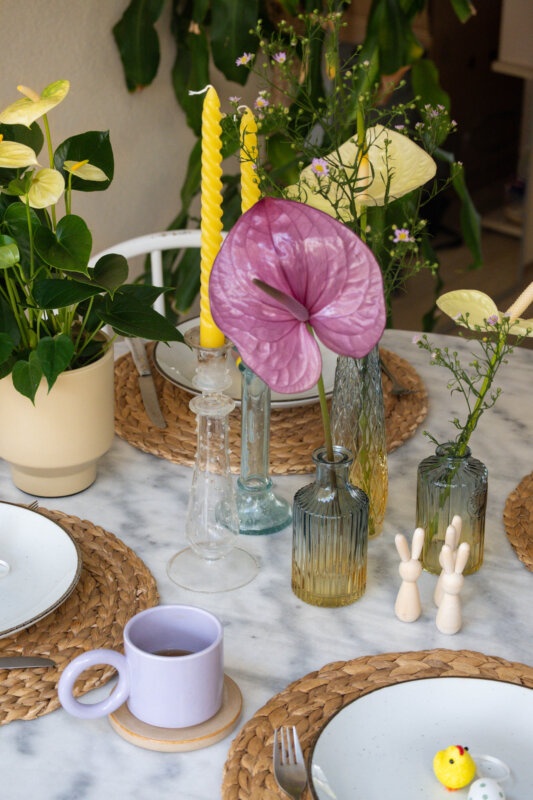 A yellow & purple Easter table with Anthuriums
